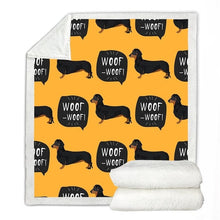 Load image into Gallery viewer, Image of a dachshund blanket with black and tan dachsunds with woof woof text