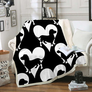 Image of a dachshund throw blanket with black and white dachshunds and hearts