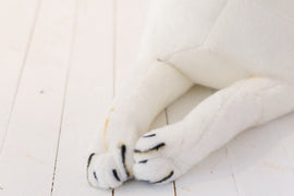 image of a woman playing with an adorable beagle stuffed animal plush toy - paws