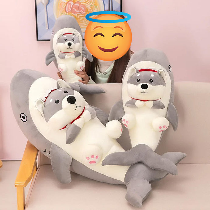 Image of a girl with three Husky plush toys and pillows in three sizes