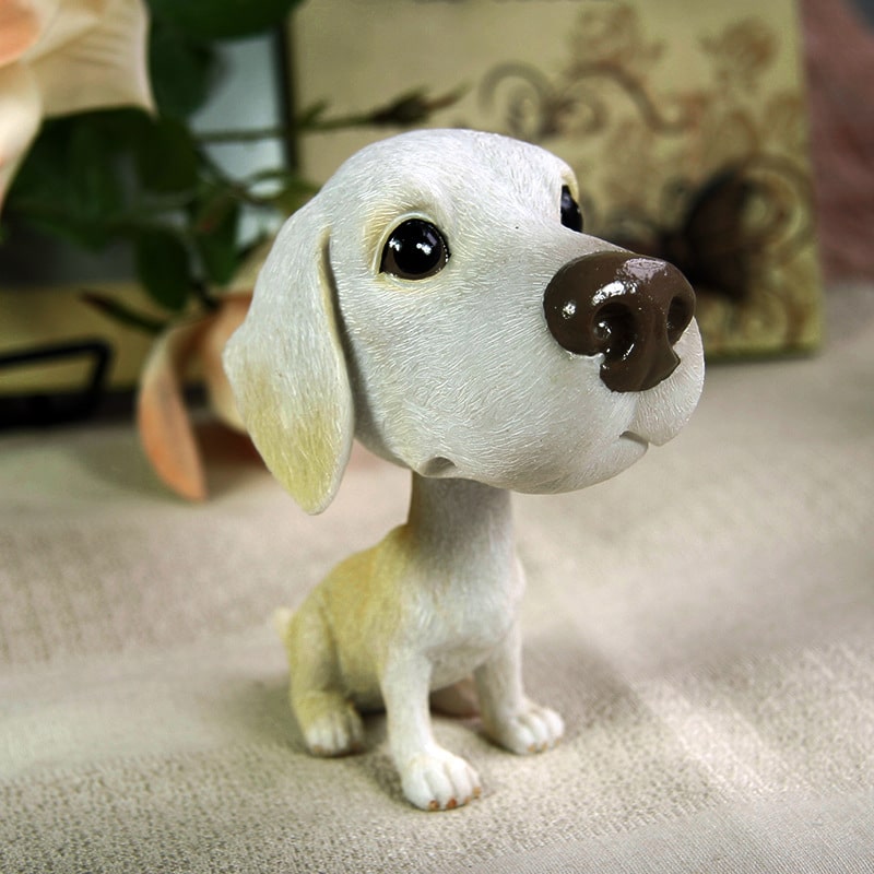 Image of an adorable realistic and lifelike Yellow Lab bobblehead
