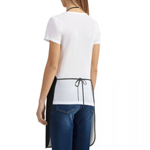 Load image into Gallery viewer, image of a woman wearing a black sheltie mom apron in white background - back view