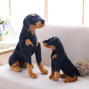 image of two rottweiler stuffed animal plush toys 