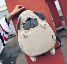 Load image into Gallery viewer, Image of a pug backpack made of corduroy with the cutest pug features, floppy ears and all