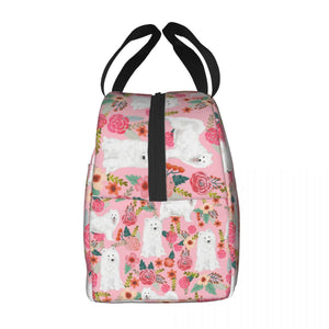 Side image of an insulated American Eskimo Dog lunch bag with exterior pocket in bloom design