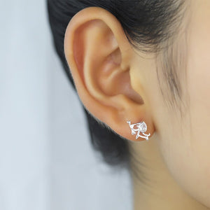 Image of a lady wearing Beagle earrings made of silver