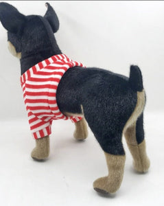 This image shows an adorable, standing Black Chihuahua Stuffed animal with big floppy ears and a small tail from its back.
