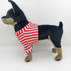 This image shows an adorable, standing Black Chihuahua Stuffed animal with big floppy ears from the side.