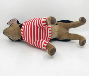 This image shows an adorable, standing Black Chihuahua Stuffed animal lying on the floor while showing it's belly.