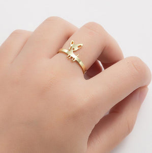 Image of a lady wearing a Gold Chihuahua ring