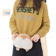 Image of a lady holding butt Corgi sling bag in the most adorable plush Corgi bum design