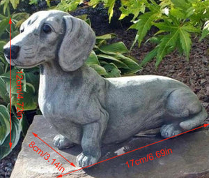 Image of a dachshund statue placed in a garden