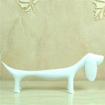 Image of a Dachshund statue in the color white made of resin