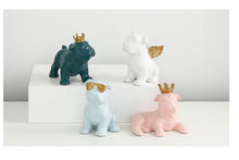 Load image into Gallery viewer, Image of four bulldog statues made of ceramic in the color pink, light blue, teal, and white