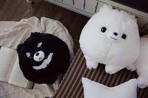Image of two adorable stuffed Dog plush toy pillows looking up