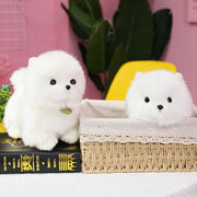 image of two adorable pomeranian stuffed animal plush toys in a basket and on a book