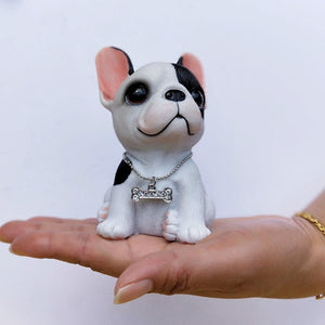 Image of a sitting french bulldog figurine in the color pied black and white