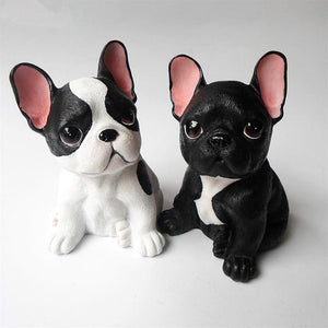 Image of two french bulldog figurines in the color pied black and white and black