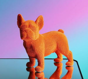 Image of a textured french bulldog statue made of resin in the color orange