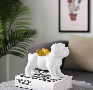 Image of an English Bulldog statue with gold plated angel wings in a living room