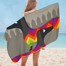 Load image into Gallery viewer, Image of a girl holding a dachshund towel on a beach with aftrican tribal color dachshunds