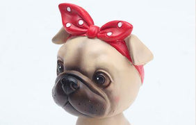 Image of a nodding girl Pug bobblehead close view