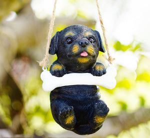 Image of a super cute hanging Rottweiler statue