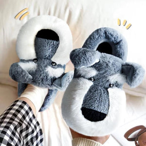 Image of a person holding a wearing super cute schnauzer slippers