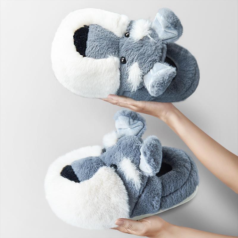 Image of a person holding schnauzer slippers with closed heel