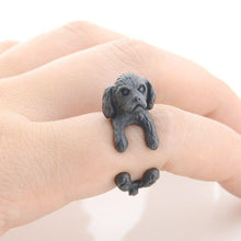 Load image into Gallery viewer, Image of a finger wrap Shih Tzu ring on the finger of a person in the color Black Gun
