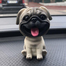 Load image into Gallery viewer, Image of a cutest smiling Pug bobblehead on a car dashboard