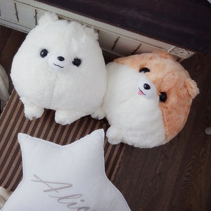 Image of an adorable stuffed American Eskimo Dog plush toy pillow looking up and sitting with his dog stuffed animal friend
