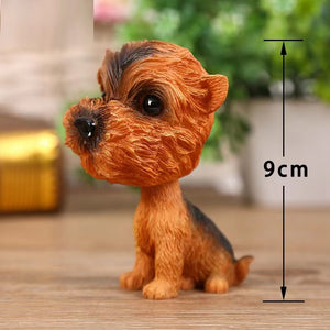 Image of a yorkie bobblehead made of resin