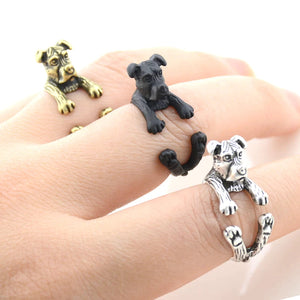 Image of a lady wearing three Sheltie rings in silver, bronze, and black