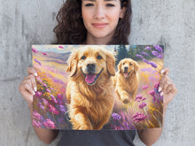 Load image into Gallery viewer, Woman holding a painting of two golden dogs in a field of flowers.