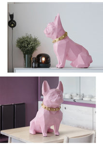 Image of a collage of two super-cute French Bulldog statues which is also a piggy bank in pink color, placed on a table