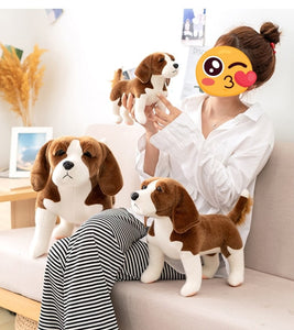 image of a woman playing with an adorable beagle stuffed animal plush toys