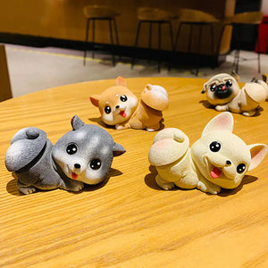 Image of four dog bobbleheads placed on the table in the the cutest bobble-butt design including Frenchie, Shiba Inu, Pug, and Husky boblehead