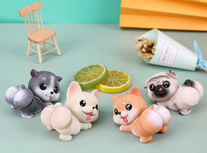 Image of four smiling dog bobbleheads in the the cutest bobble-butt design including Frenchie, Shiba Inu, Pug, and Husky boblehead