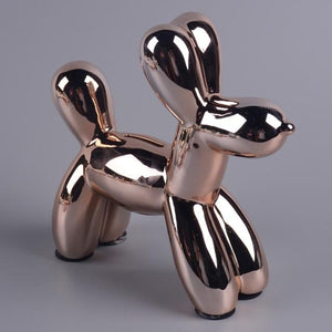 Image of a beautiful Poodle piggy bank statue in the color Rose Gold, made of ceramic