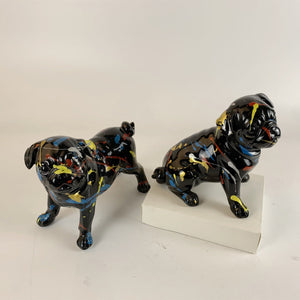 Image of black pug statues in standing and sitting design