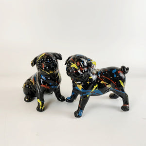 Image of black pug statues in sitting and standing design