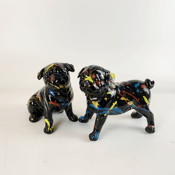 Image of two black pug statues