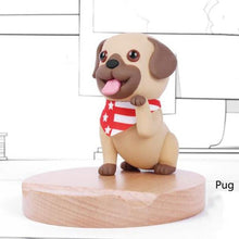 Load image into Gallery viewer, Image of a Pug phone holder in smiling Pug design