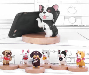 Image of seven smiling dog phone holders holding cell phones and wearing scarf design