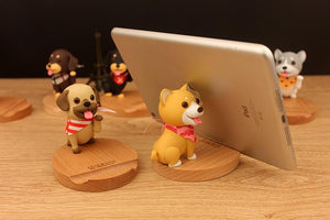 Image of dog phone holder in the cutest smiling Pug and Shiba Inu holding cell phone design