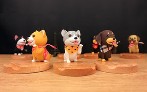 Image of three smiling dog phone stands including Shiba Inu, Husky, and Dachshund wearing scarves design