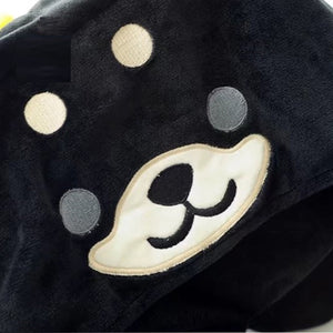 Close up image of a husky travel pillow and hoodie