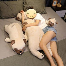 Load image into Gallery viewer, Image of a girl sleeping on the bed next to four Pug stuffed animals soft plush toys in different sizes
