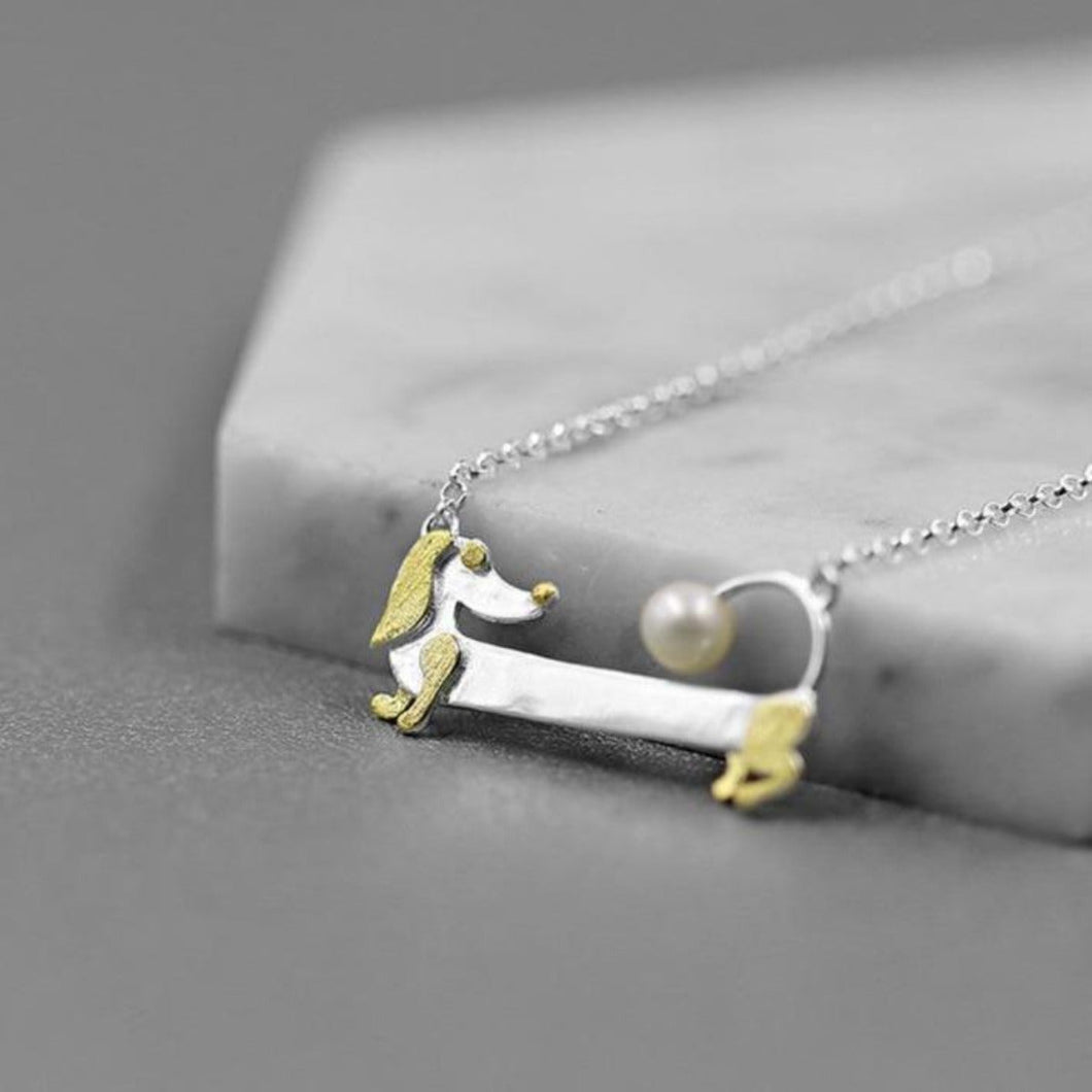Image of a Dachshund necklace with a super-cute Dachshund pendant with a real freshwater pearl design